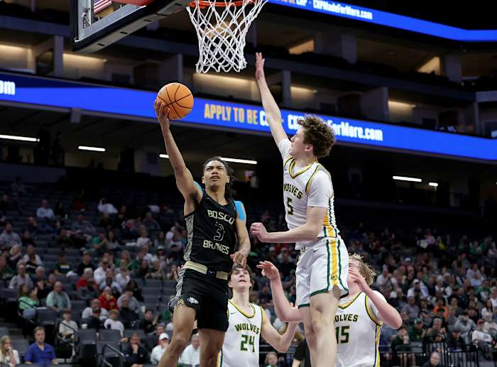 Elzie Harrington swoops in for two of his 12 points to go along with seven assists.
